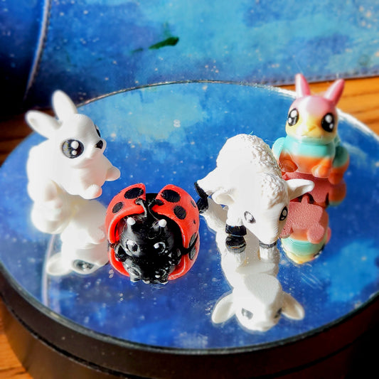 four 3D mini pets